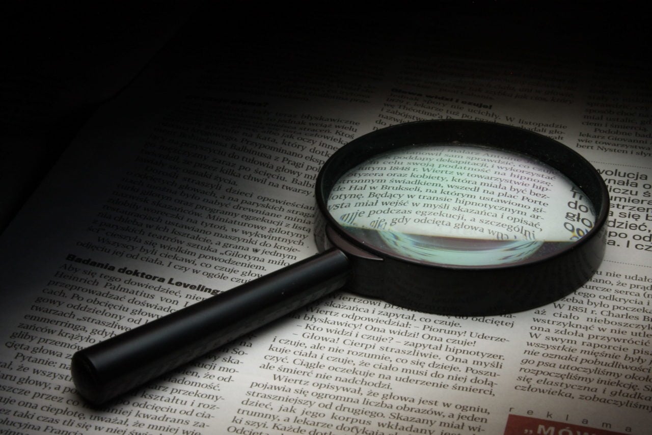 Magnifying glass on paper. Illustration of Searching in Excel.